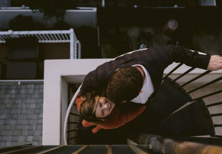 Alison Conklin image of couple on balcony from above