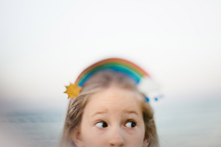 Freelensed image of girl with rainbow