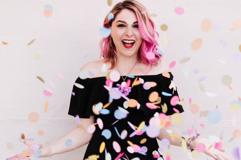 woman throwing confetti