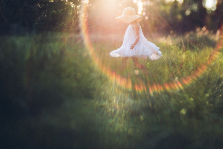 backlit photo with rainbow sunflare by Monika Colichio