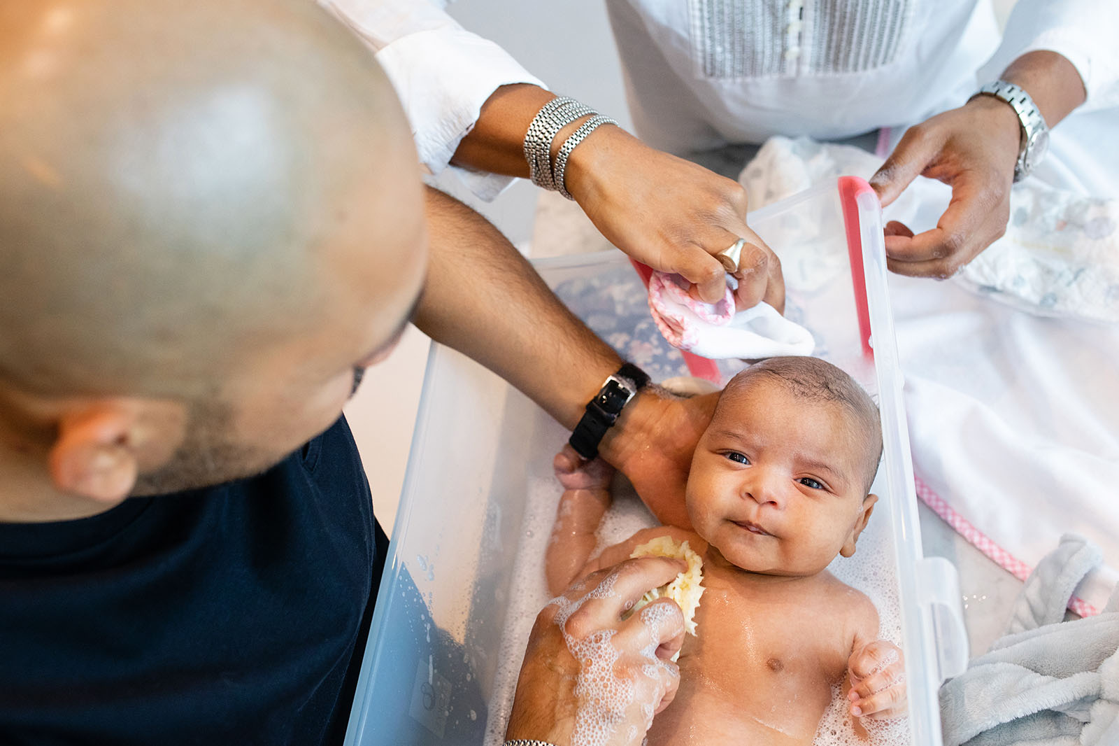 bathing-newborn-baby-Miami-Covid-safe-photo-session-Audrey-Blake-Photography 26 Fathers giving baby a bath