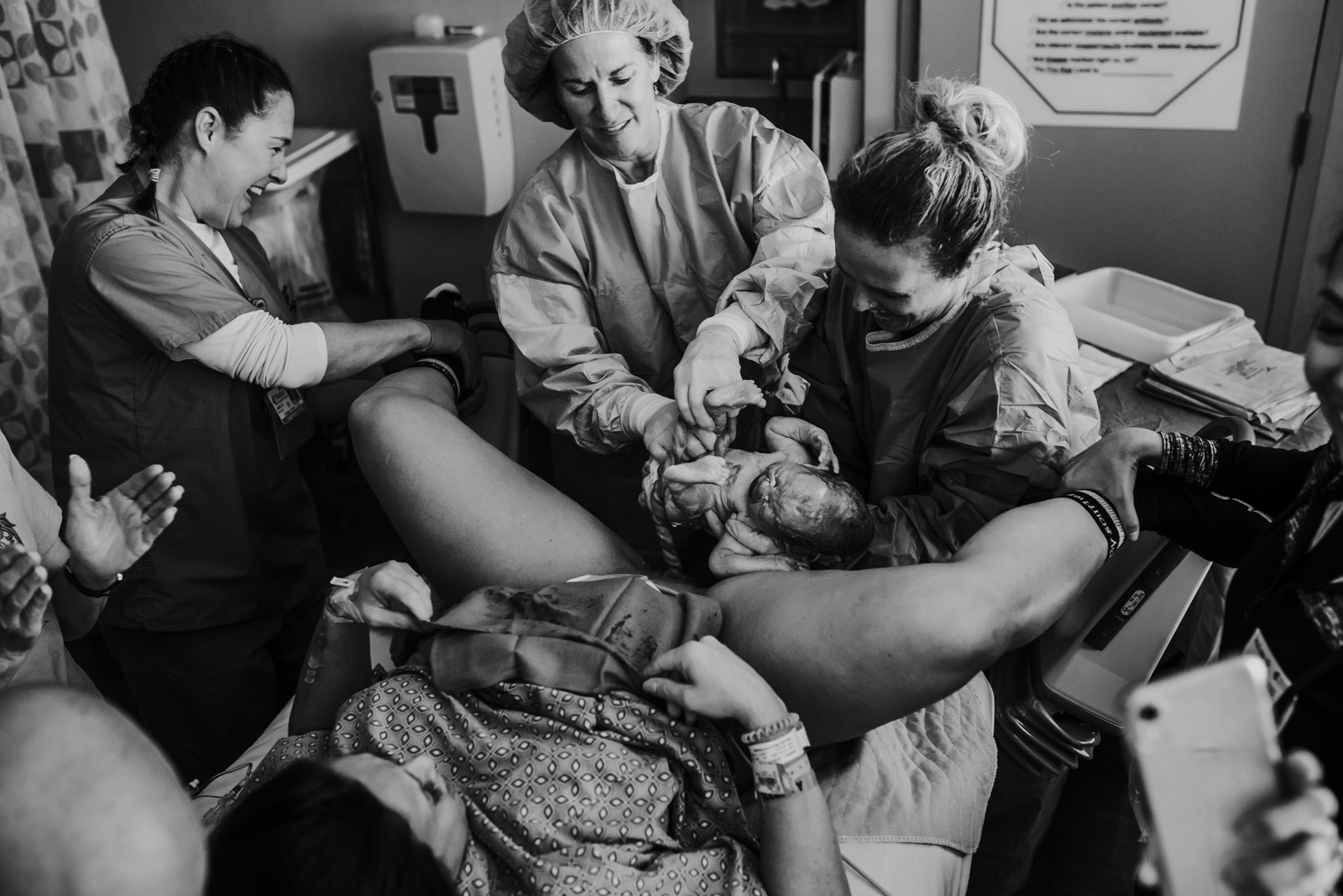 Birth-Photography-Jessica-Miles-13 Photo of medical team around a baby being born