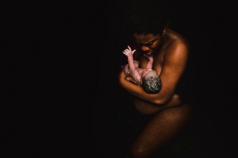 Photo of a black woman with her newborn baby by Chinelle Rojas