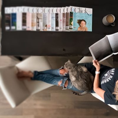 Woman reading Click magazine, shot from above