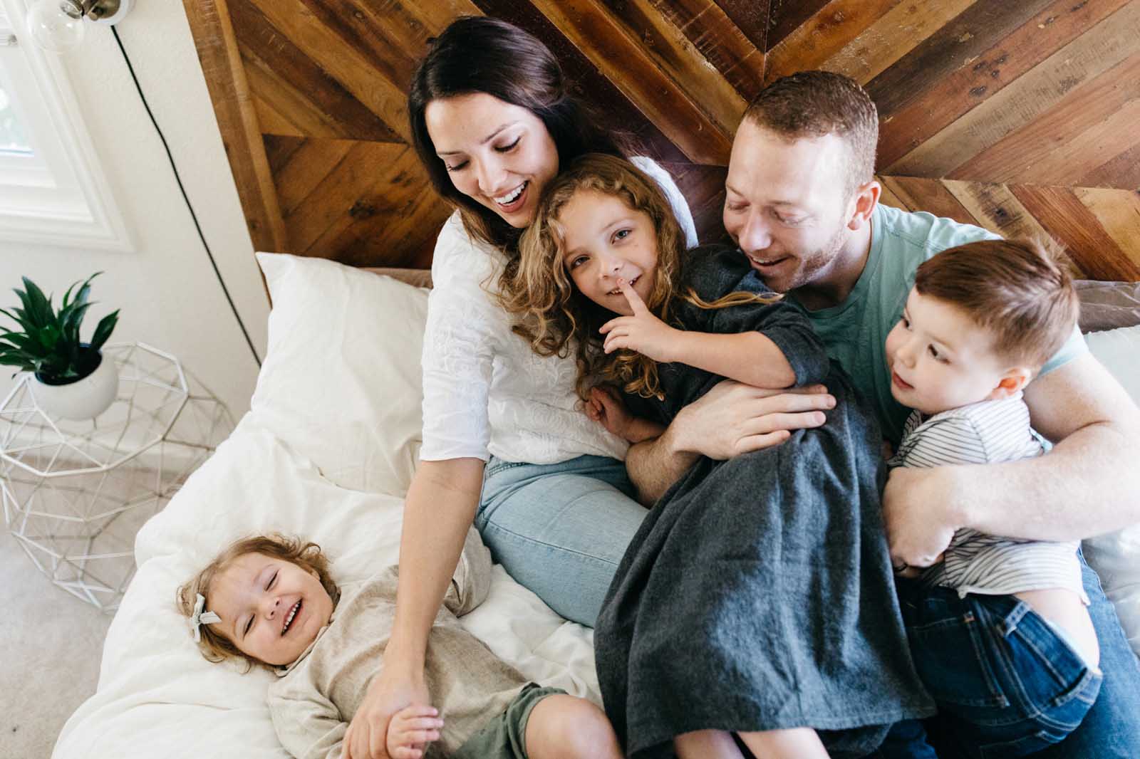 day-in-the-life-session-photography-8 Family on a bed during a day in the life photo session