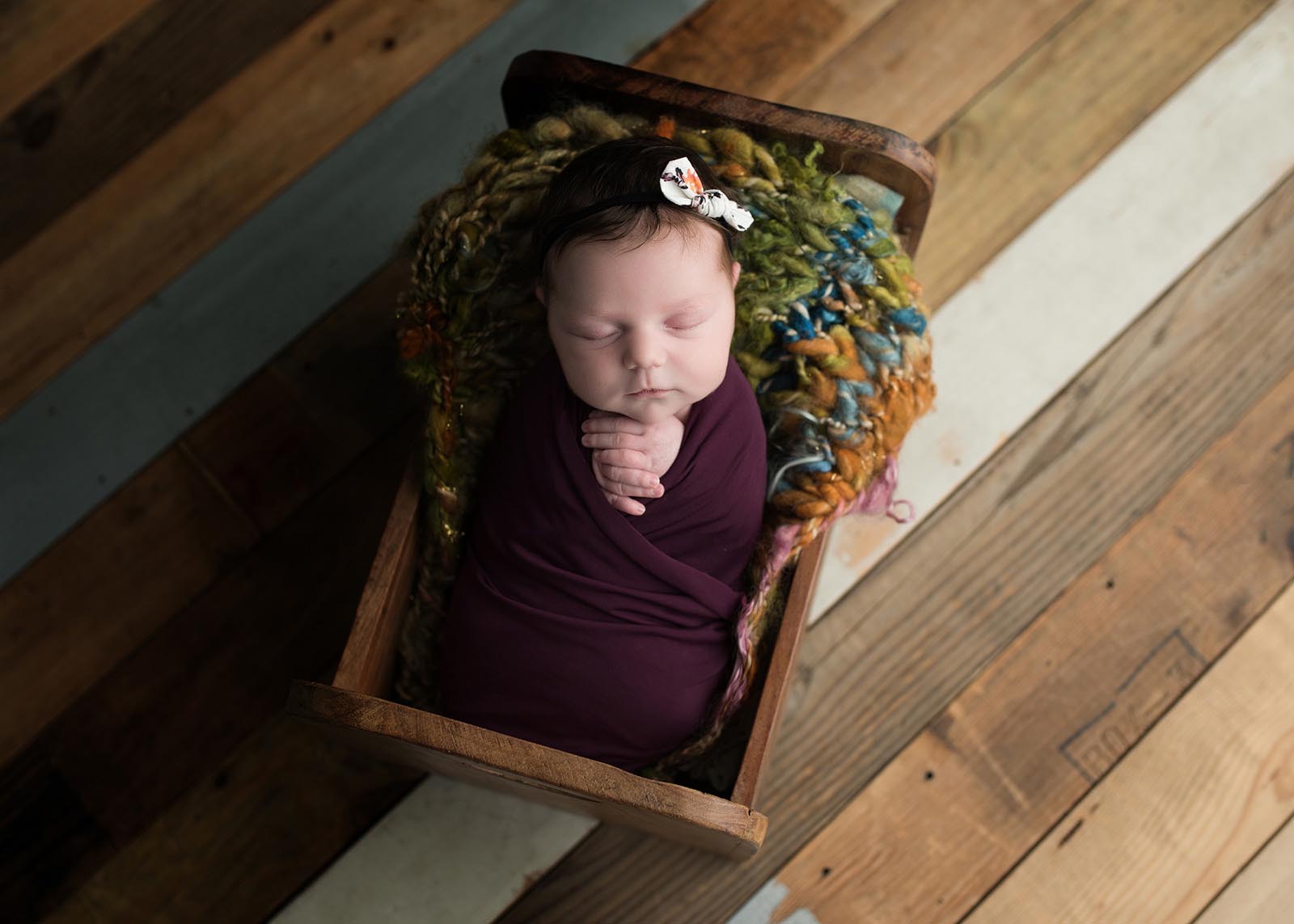 Newborn baby in a box