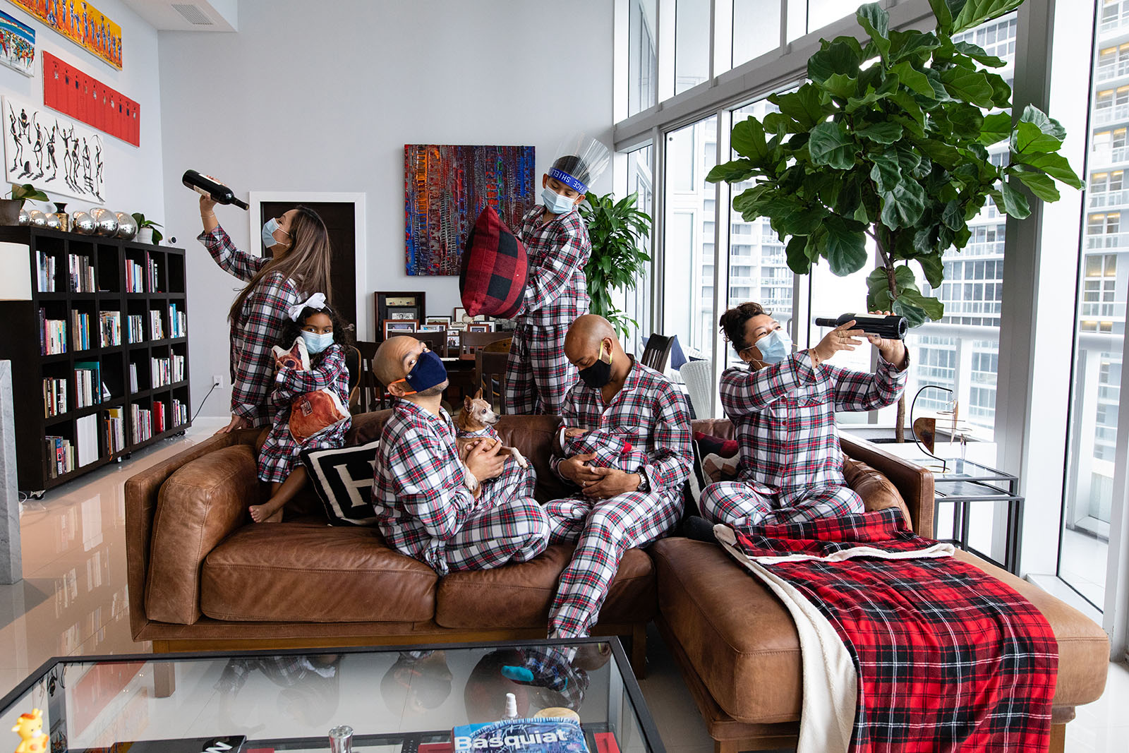 Family-holiday-photo-in-matching-pajamas-and-masks-covid-safe-photo-session-dr-hansel-tookes-audrey-blake-photography Large family in matching Christmas pajamas during COVID photo session