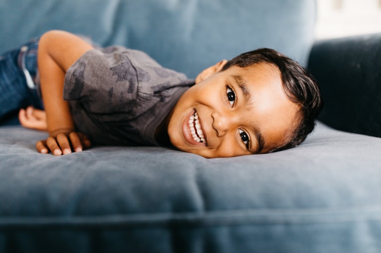 Little boy laying on sofa - Photographing shy kids