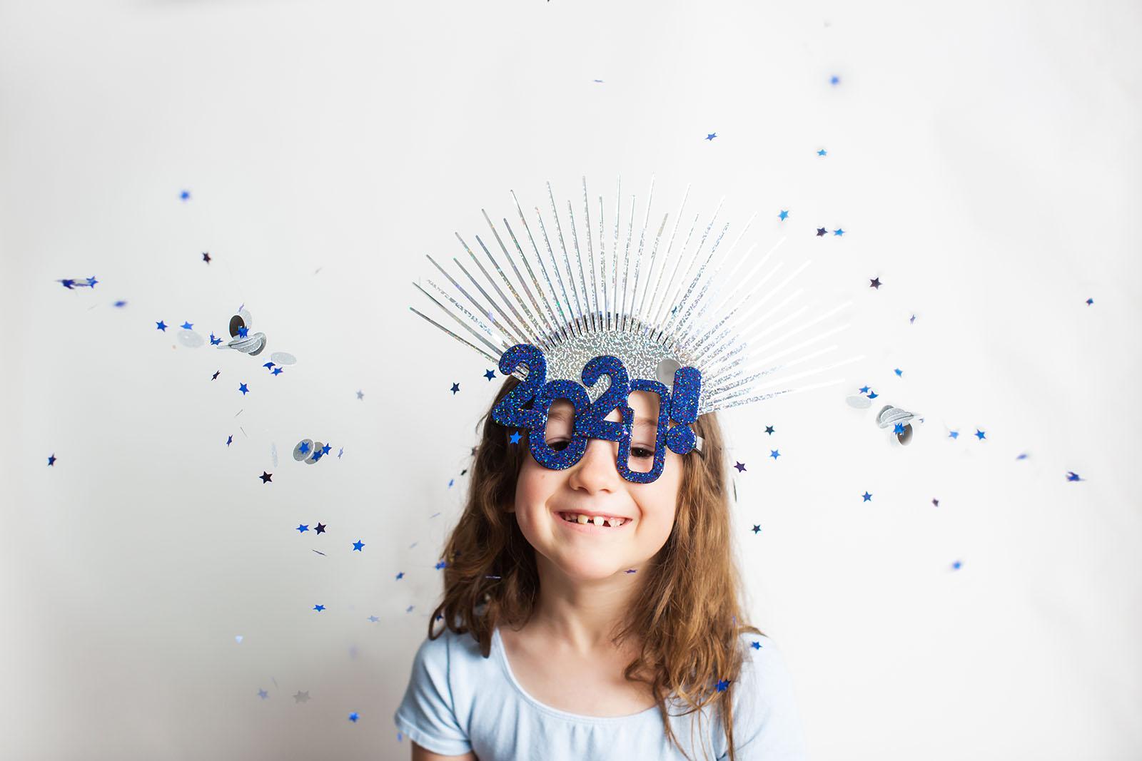 Goal setting for the new year girl celebrating Little girl in 2020 new years mask