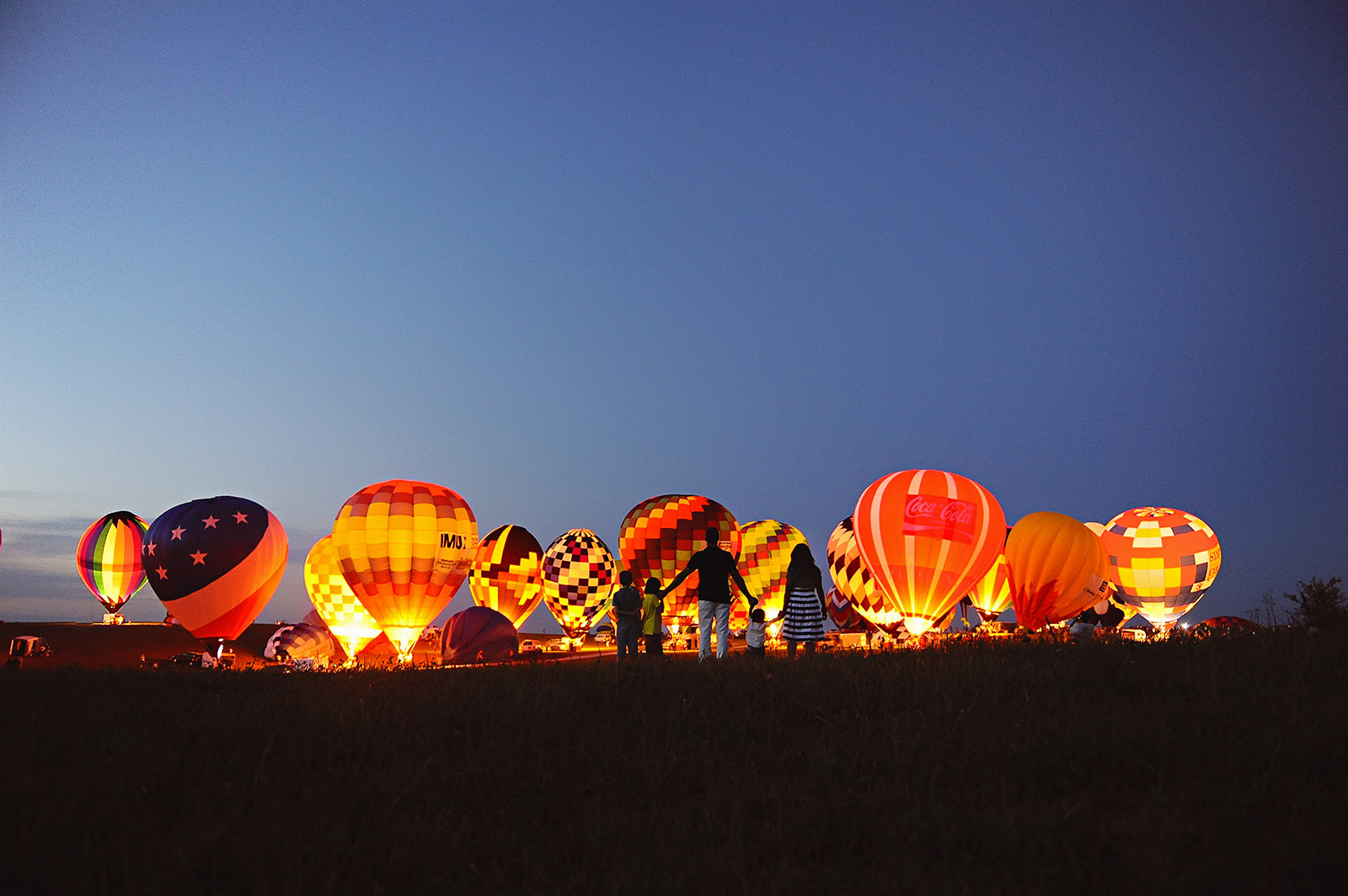 hot air balloons by Tasha Herrgott The summer months offer up countless opportunities to infuse your lifestyle sessions — with clients or your own brood — with color, whimsy and pure joy. To help you plow this rich loam, we’re planting a few ideas, from the sublimely simple to the ridiculously complex. (Bonus: These’ll keep the kids occupied for a minute, too.)