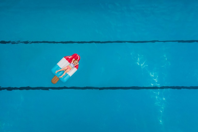 Photo of girl on floatie in pool from above