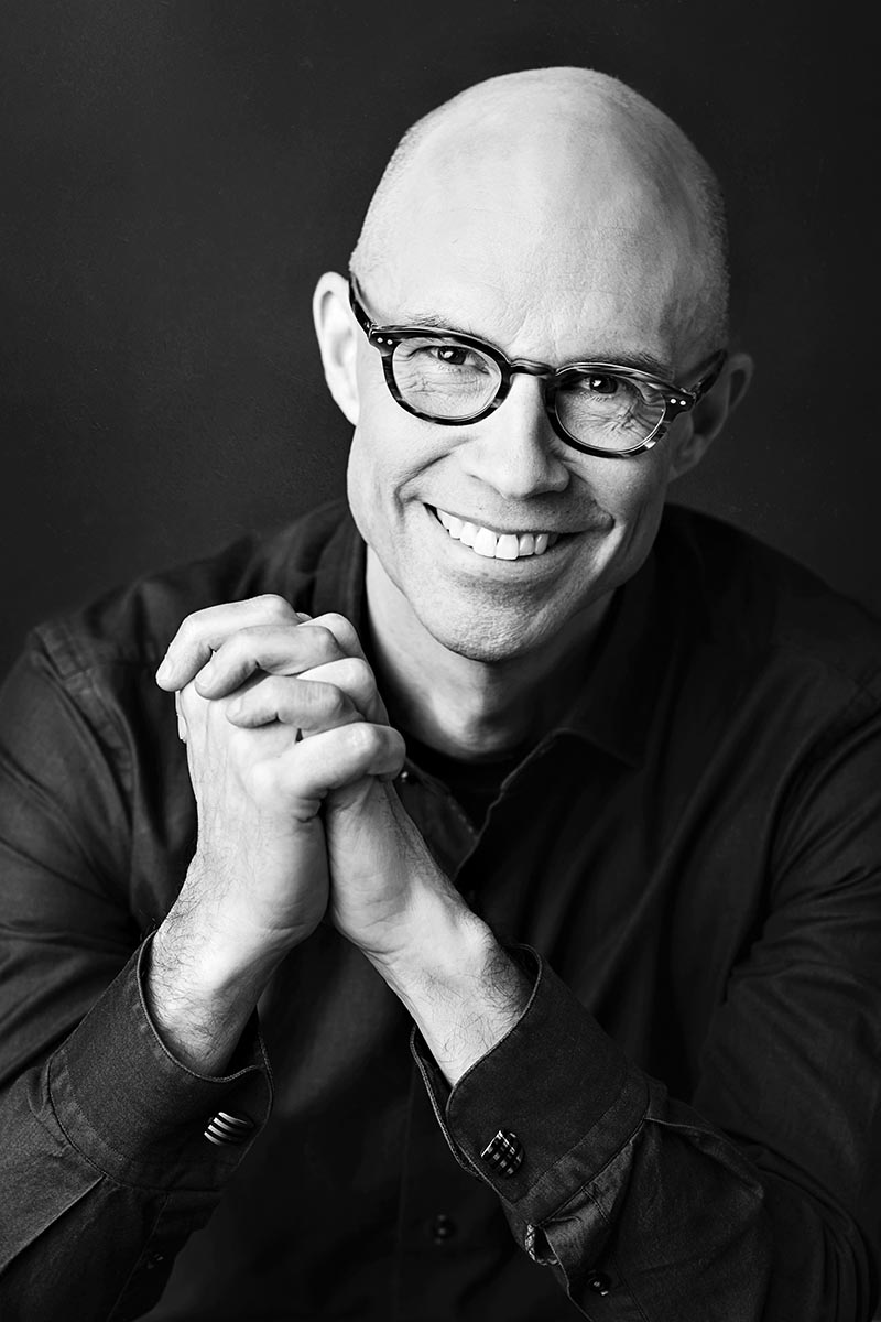 leslie-crane-creative-headshots-6 Headshot of a man with his hands folded.