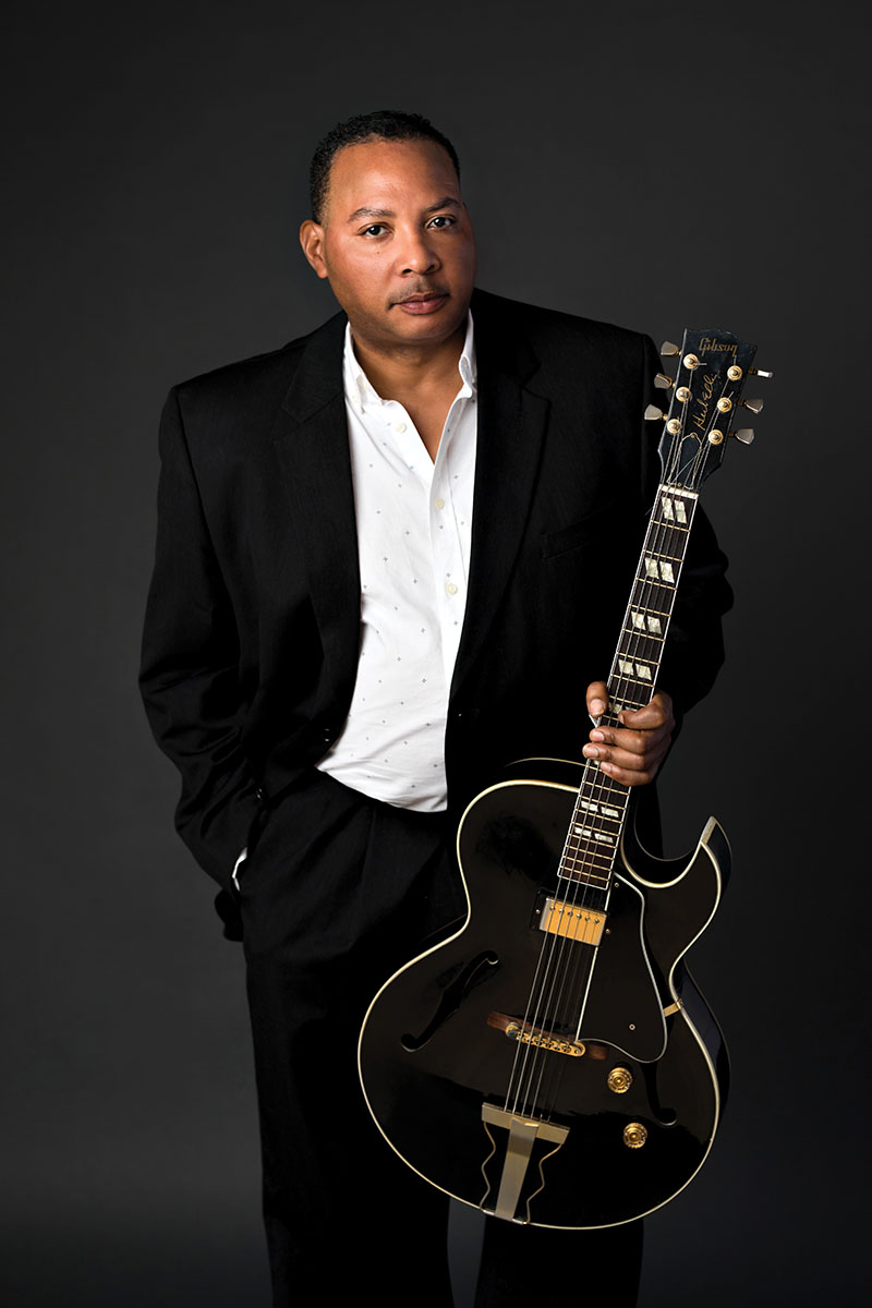 leslie-crane-creative-headshots-7 Headshot of a musician with his guitar