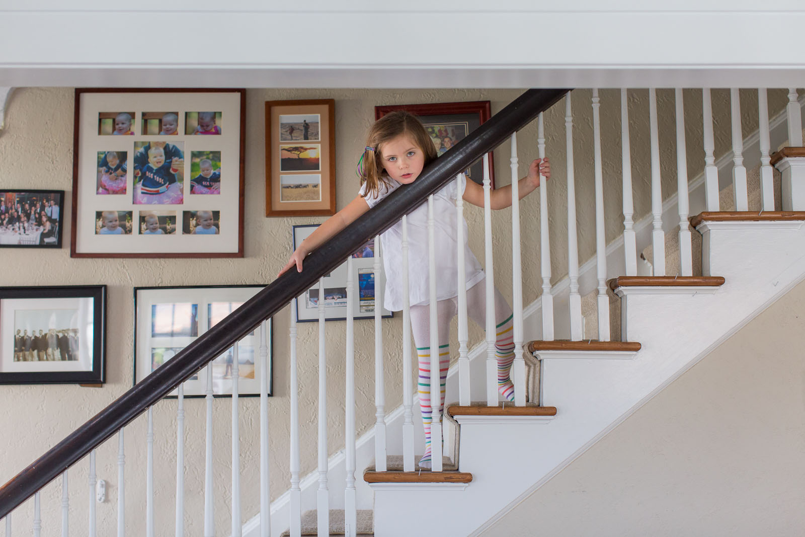 little girl playing on the stairs by Jaye McLaughlin