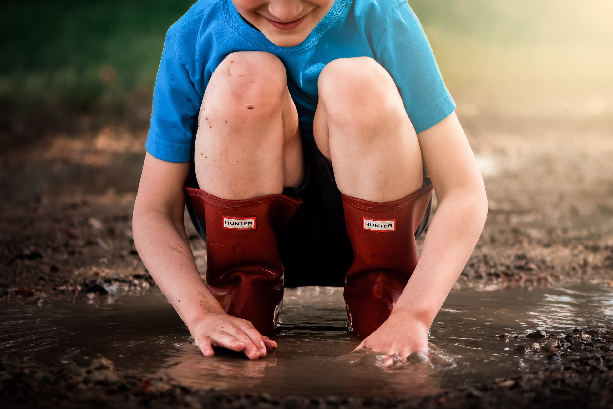 mud-katharine-vogel Boy playing in mud