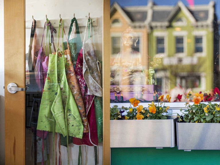 A diptych of art smocks and a colorful house