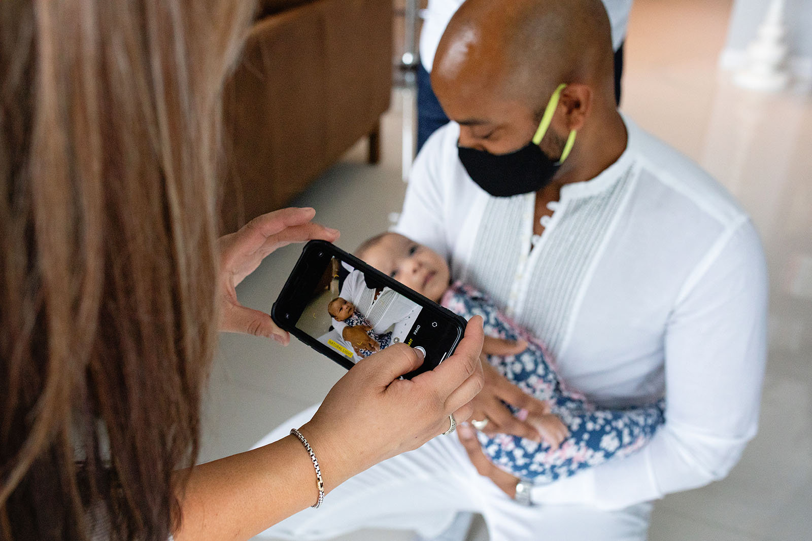 photo-of-an-iphone-photo-being-taken-Miami-Covid-safe-photo-session-Audrey-Blake-Photography-with-dr-hansel-tookes 31 Masked father holds baby, newborn sessions during COVID