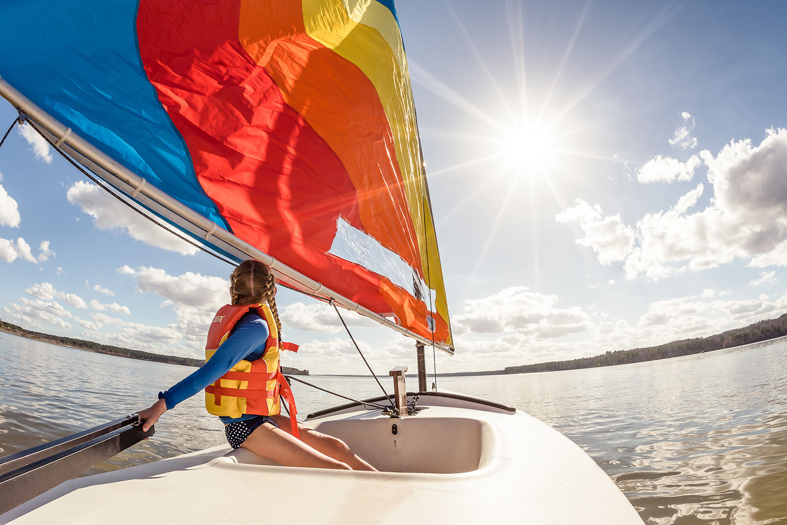 photo of girl on a sailboat by Julia Crim The summer months offer up countless opportunities to infuse your lifestyle sessions — with clients or your own brood — with color, whimsy and pure joy. To help you plow this rich loam, we’re planting a few ideas, from the sublimely simple to the ridiculously complex. (Bonus: These’ll keep the kids occupied for a minute, too.)