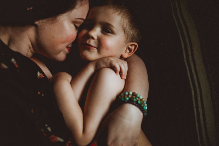 photo of mom and son snuggling by Keziah Kelsey