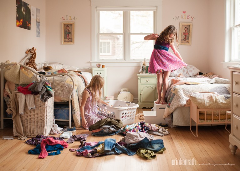 photo of two girls trying on clothes in their room by Erin Konrath