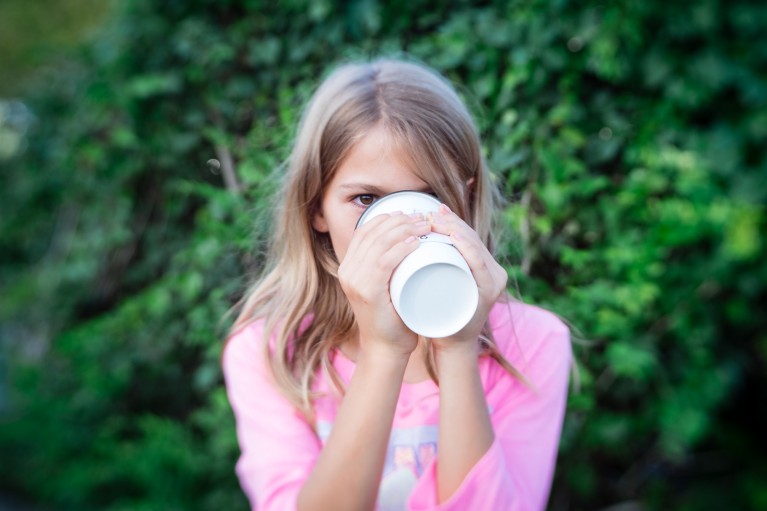 picture of girl drinking a hot drink outside by Erica Everhart