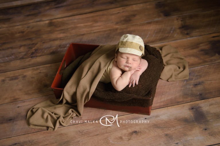 picture of baby in a box by Chavi Malka