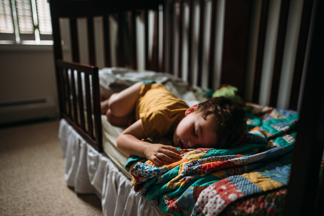 picture of kid sleeping in toddler bed by Elise Meader