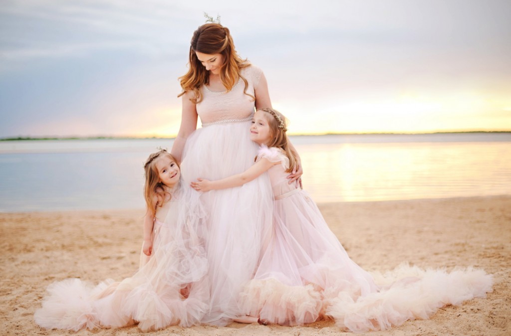 picture of mom and two daughters on the beach by Woodsy Wonders Photography