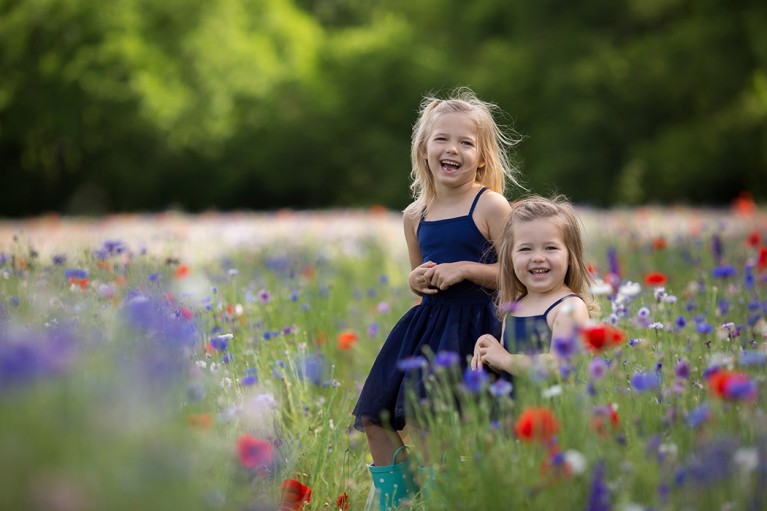 picture of two girls in a field of flowers by Eliz Alex Photography