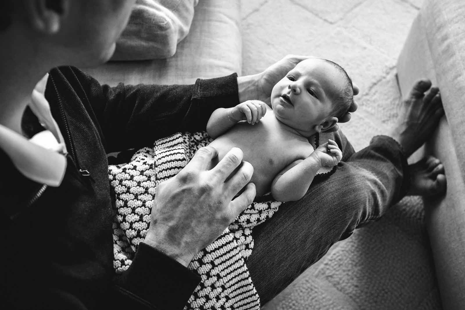 rebecca-wyatt-in-person-marketing-newborn A black and white photo of a newborn in moms arms.