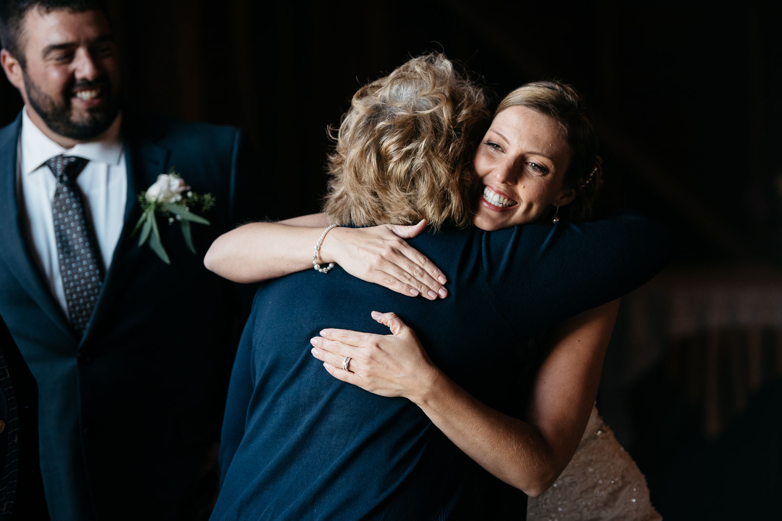 Second-Shooter-Blog-Click-by-Mariah-Fisher-4 A mom hugs a bride at a wedding