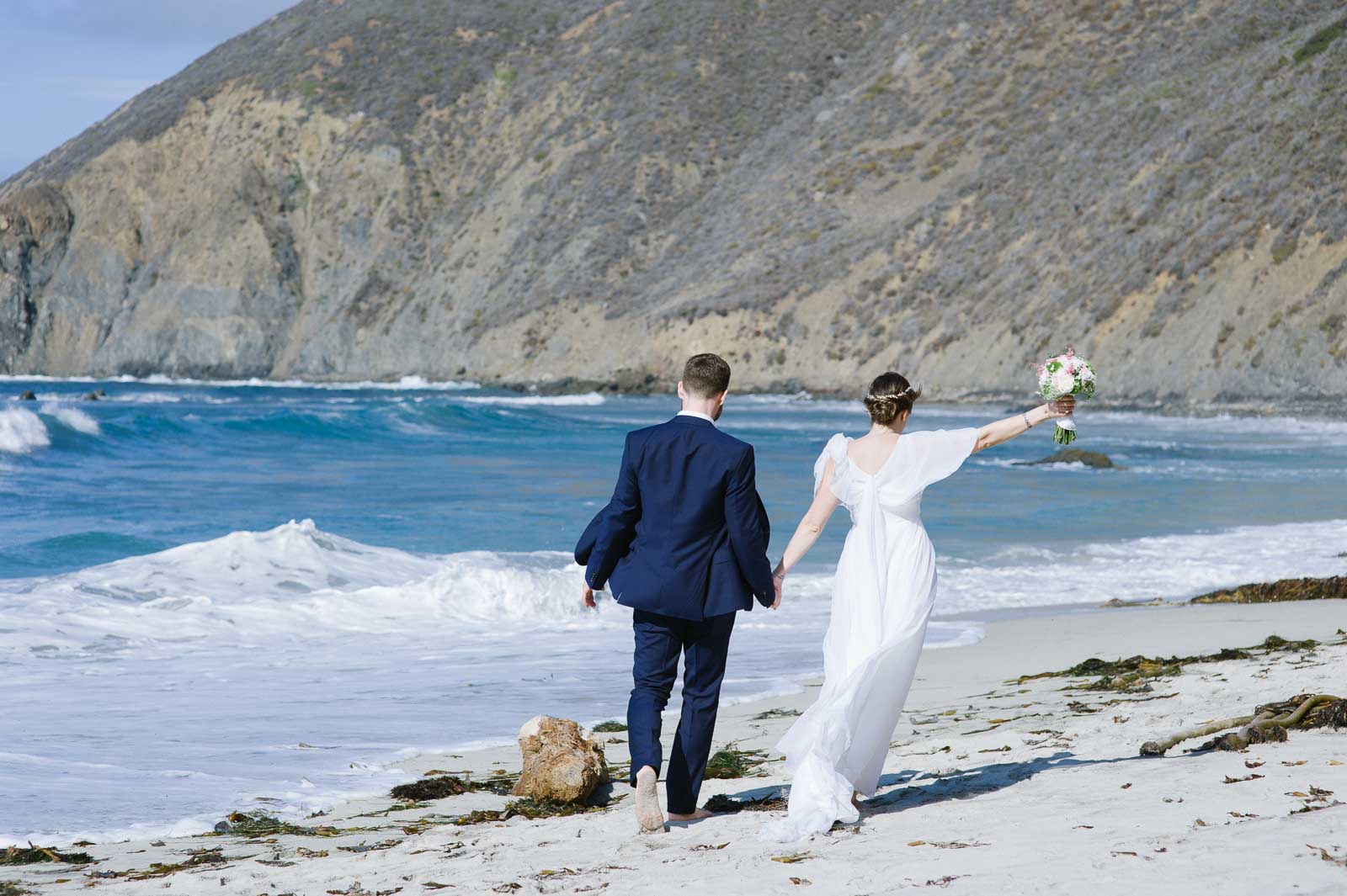 Second-Shooter-Blog-Click-by-Mariah-Fisher-7 A couple runs on a beach after their wedding