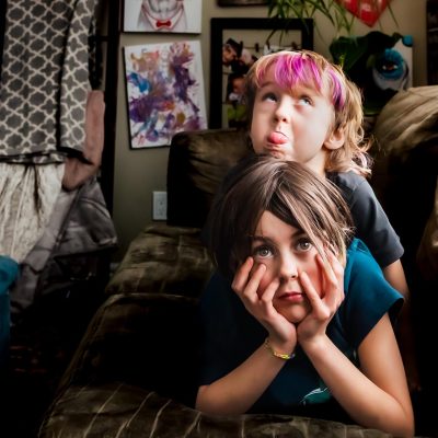 documentary family photo of two kids at home