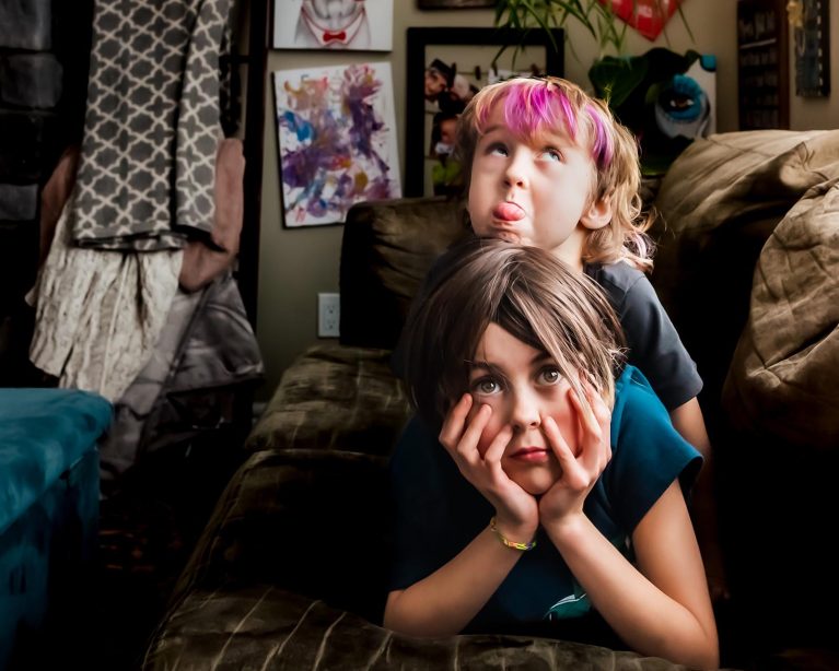 documentary family photo of two kids at home
