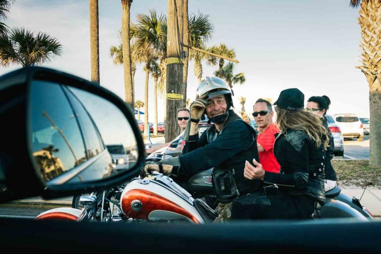 People in a motorcycle in a street photo