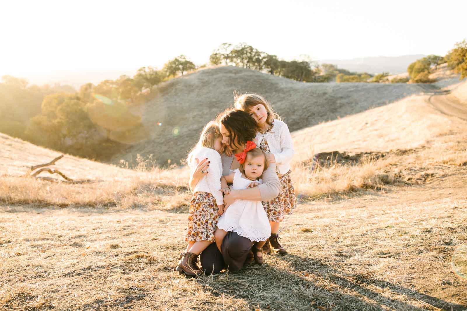 TarahPhotography-WalnutCreek-31miles A photography travel session in Walnut Creek, a mom hugs her three girls