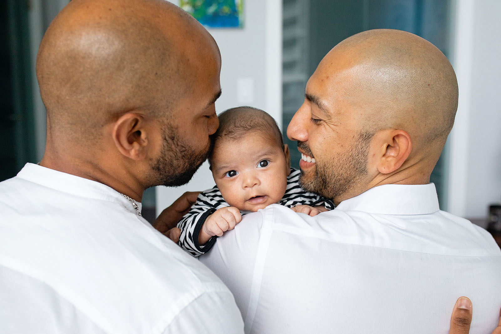 two-dads-cudding-with-their-newborn-baby-girl-Miami-Covid-safe-photo-session-Audrey-Blake-Photography 24 Dads hold their baby during newborn photo session